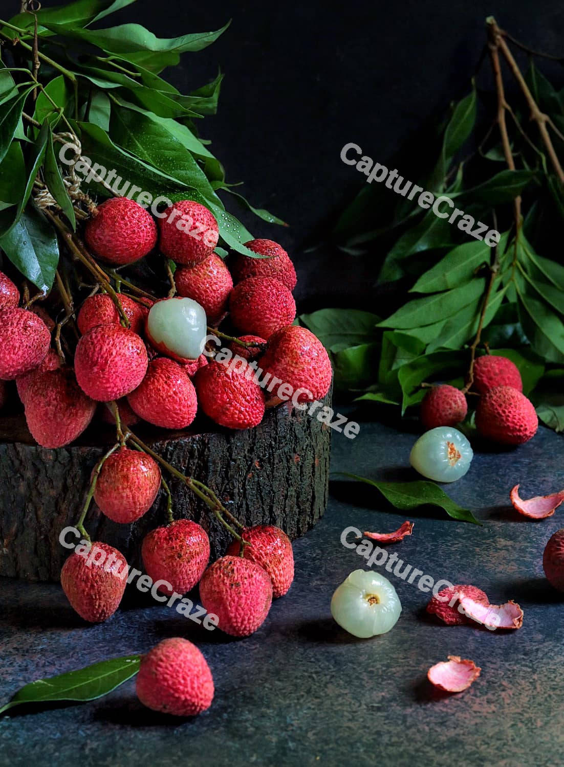 Lychee fruit on a tree log